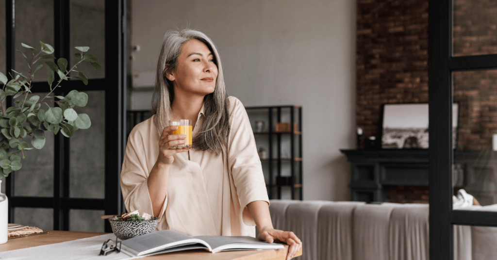ways to support healthy aging - woman drinking orange juice