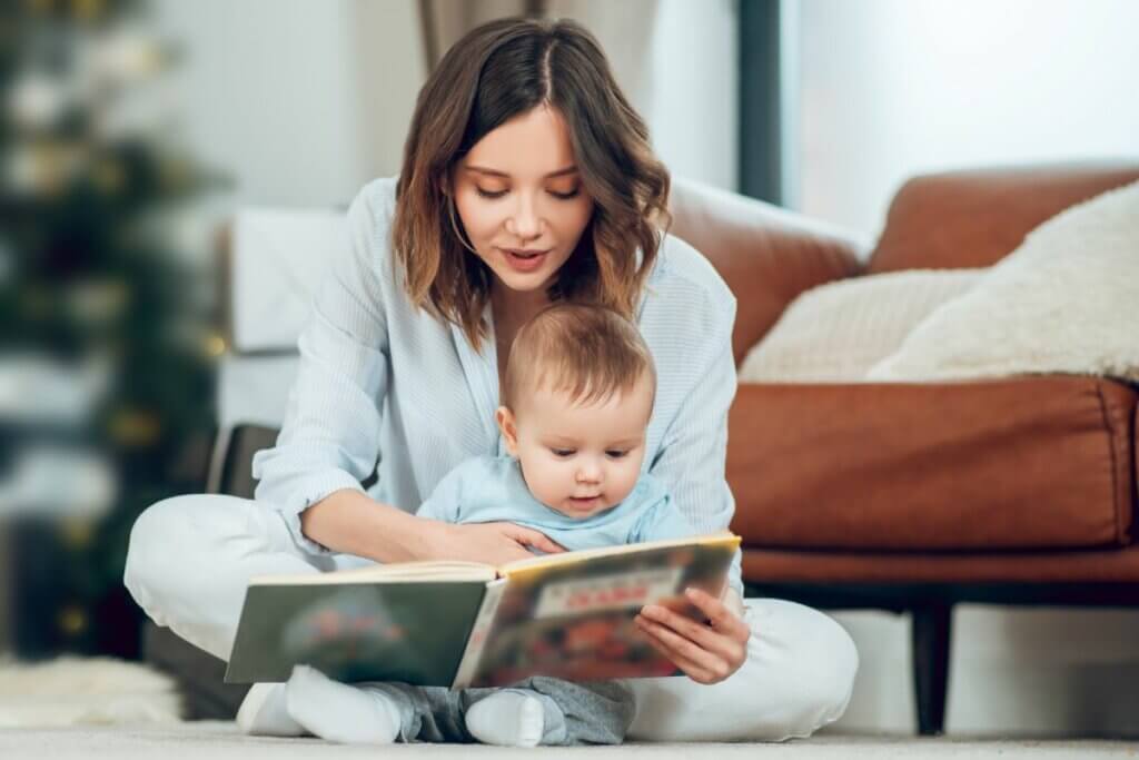 mom reading a book to a baby