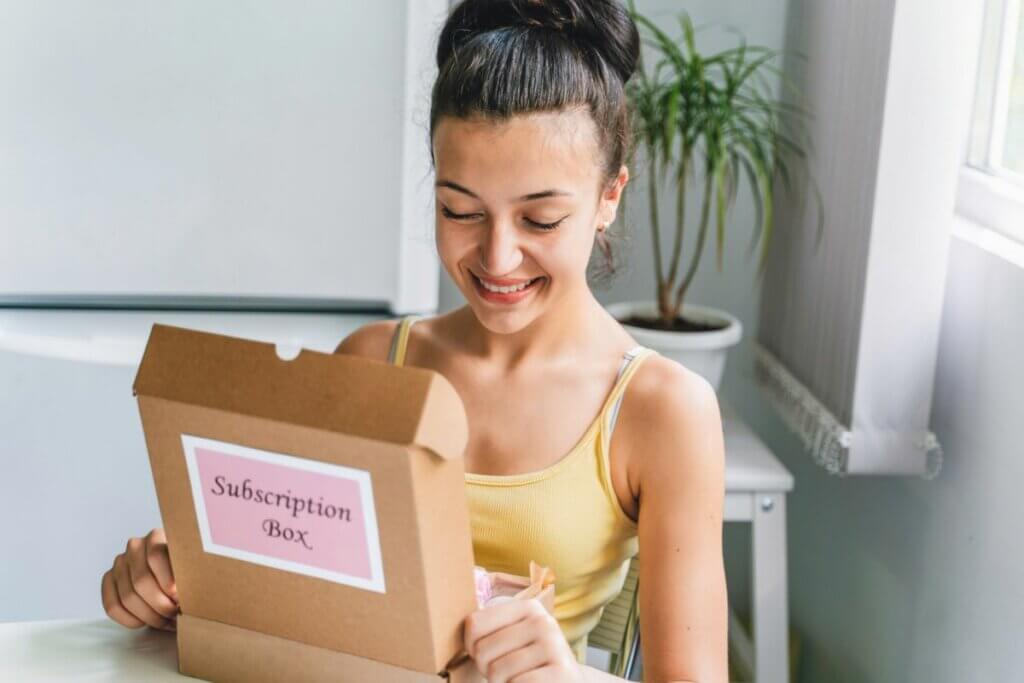 a young girl with a subscription box